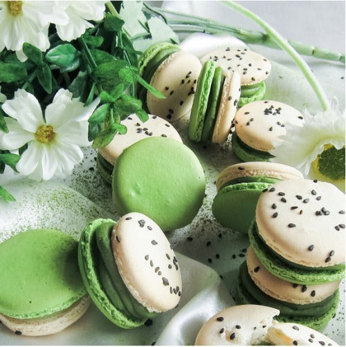 bi colored Macaron shells filled with matcha green tea white chocolate cream and black sesame square crunch