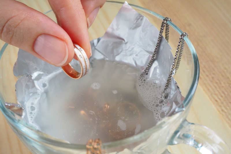Jewelry cleaning in water with liquid soap