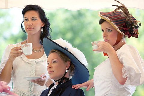 Ladies dressed up having afternoon tea