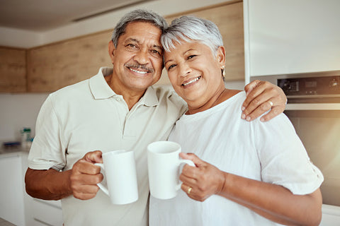 Older man and lady drinking tea