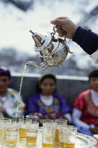 Moroccan tea ceremony showing pouring of the tea from a height