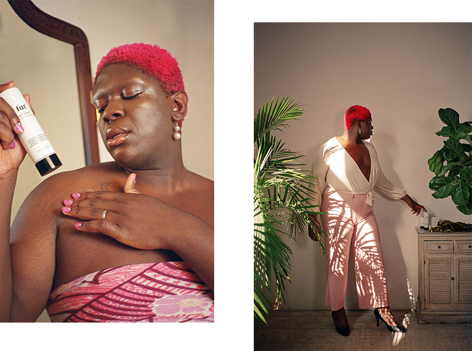 Woman with short pink hair holding Silk Scrub / woman in pink pants next to plants.