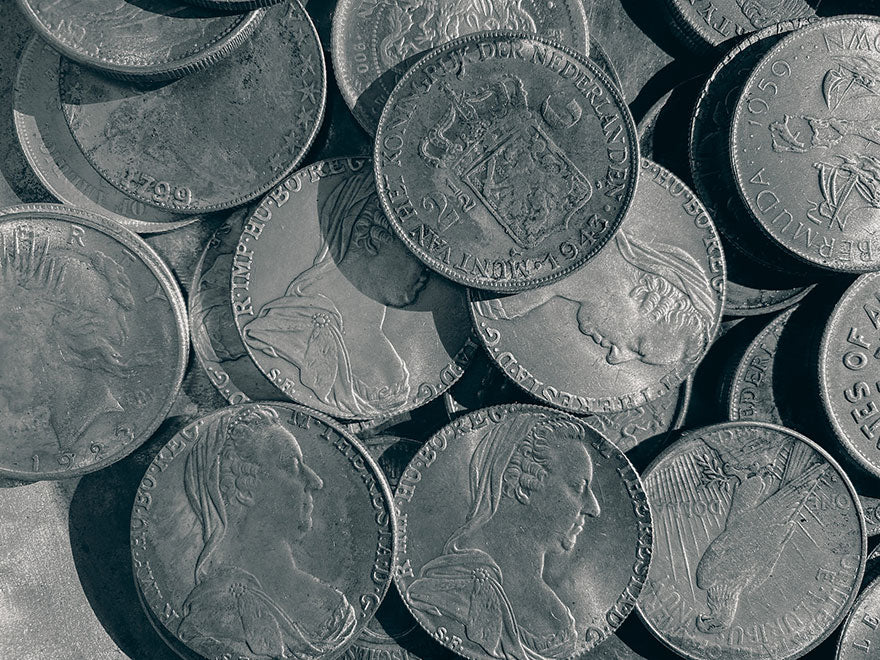 A collection of older international silver coins.