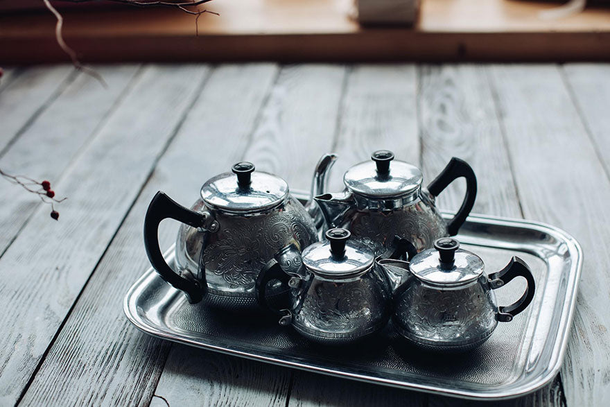 Silver tea sets featuring reliefs and patterns