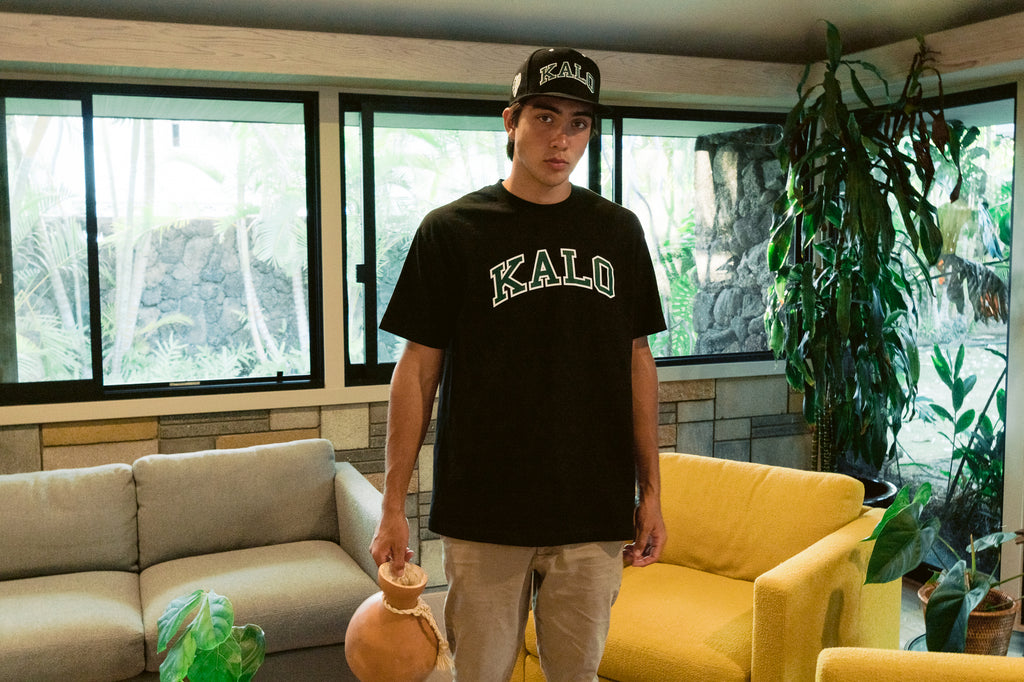 Keao Anthony wears the Kalo Snapback Hat - Black and Kalo Tee - Black