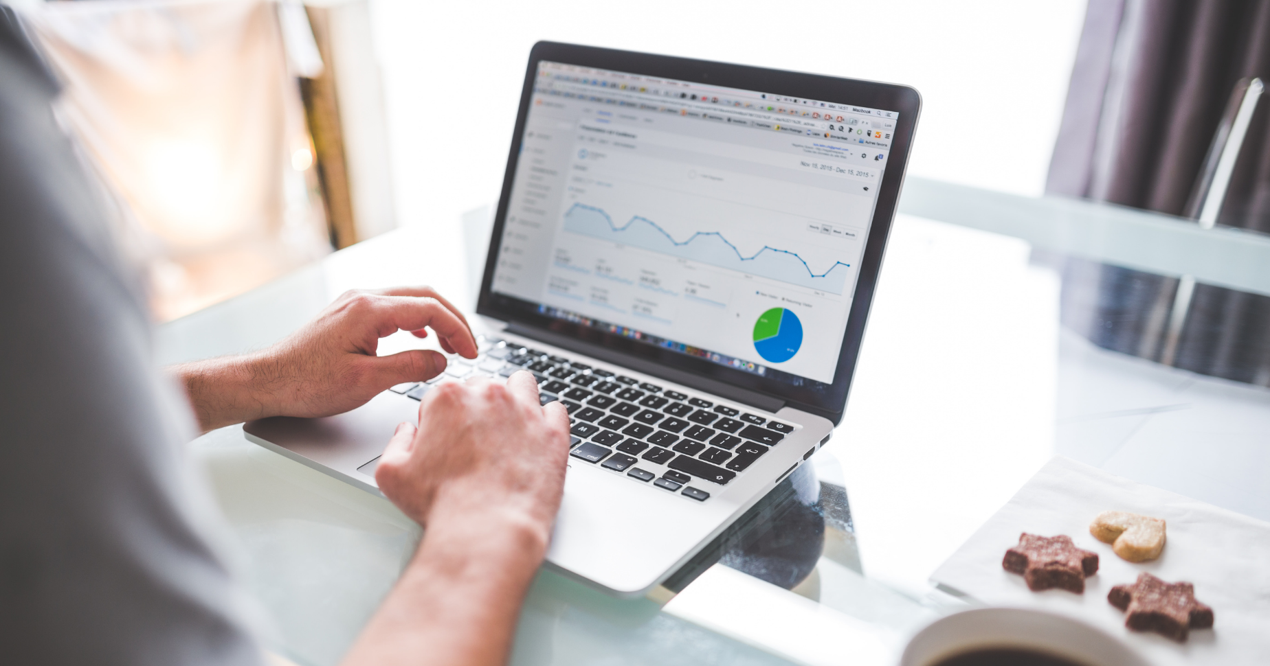 woman at computer looking at analytics