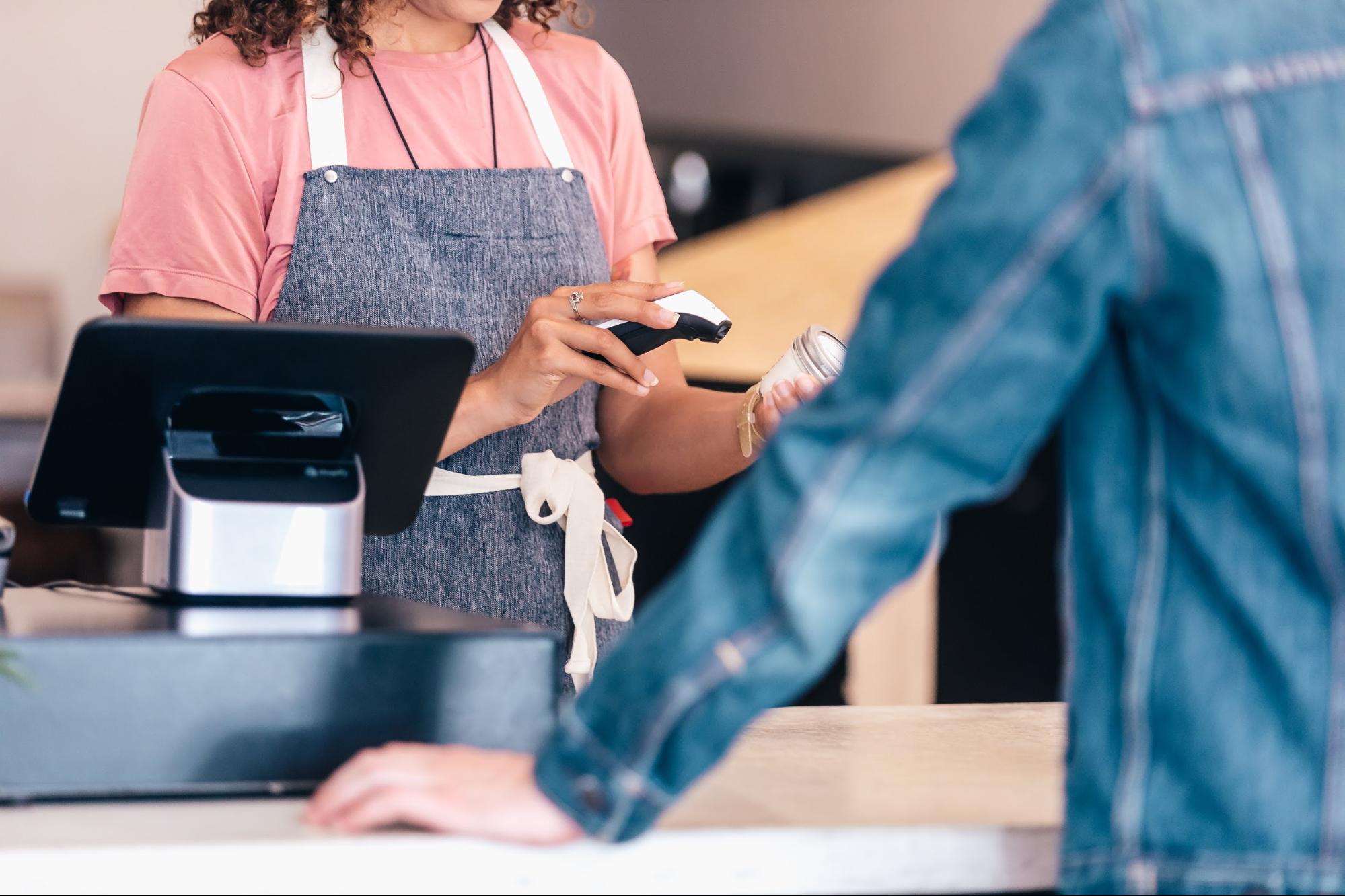 store clerk scanning barcode