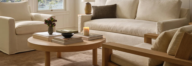 Image of living room with couch, chairs, and coffee table