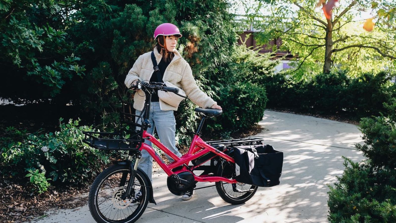 Image of a person standing with their electric bicycle