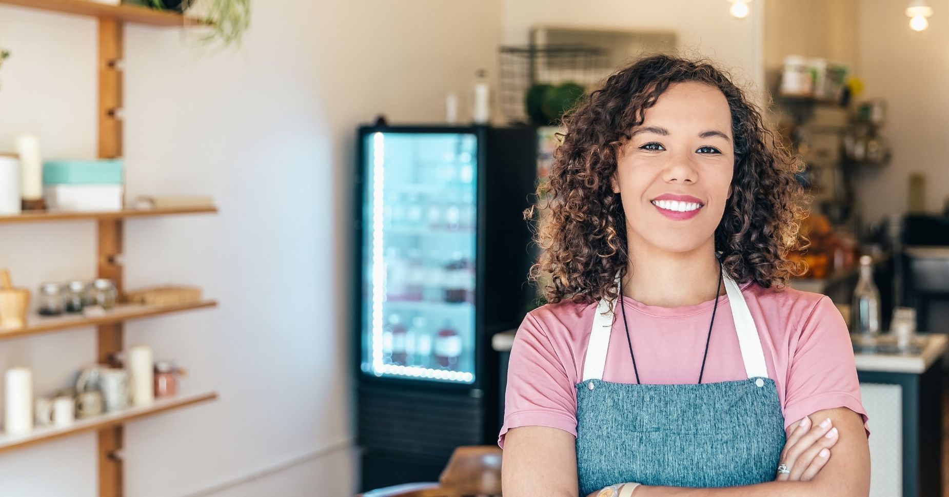 Store owner smiling