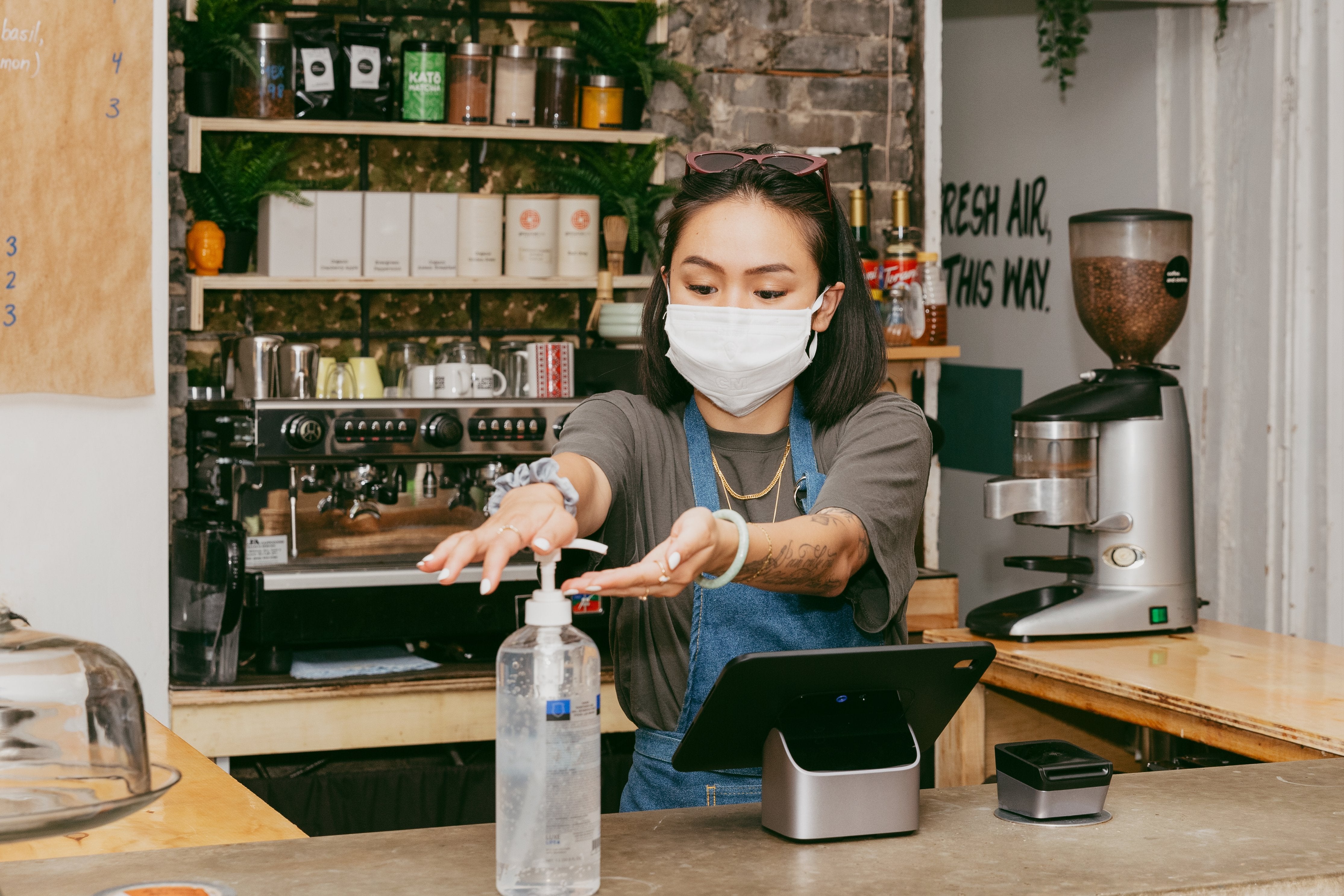 Retail staff sanitizing