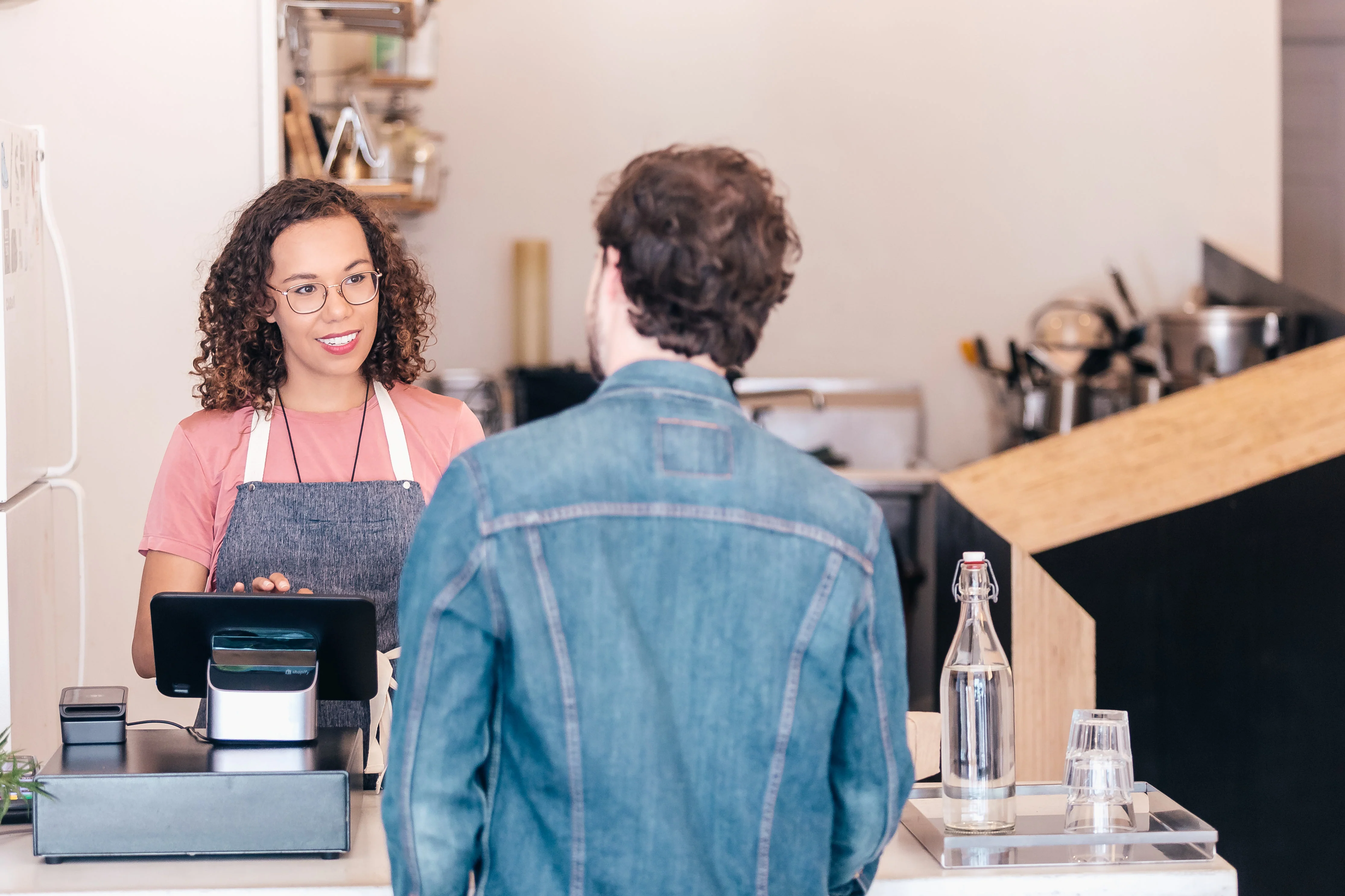 Cashier helping customer