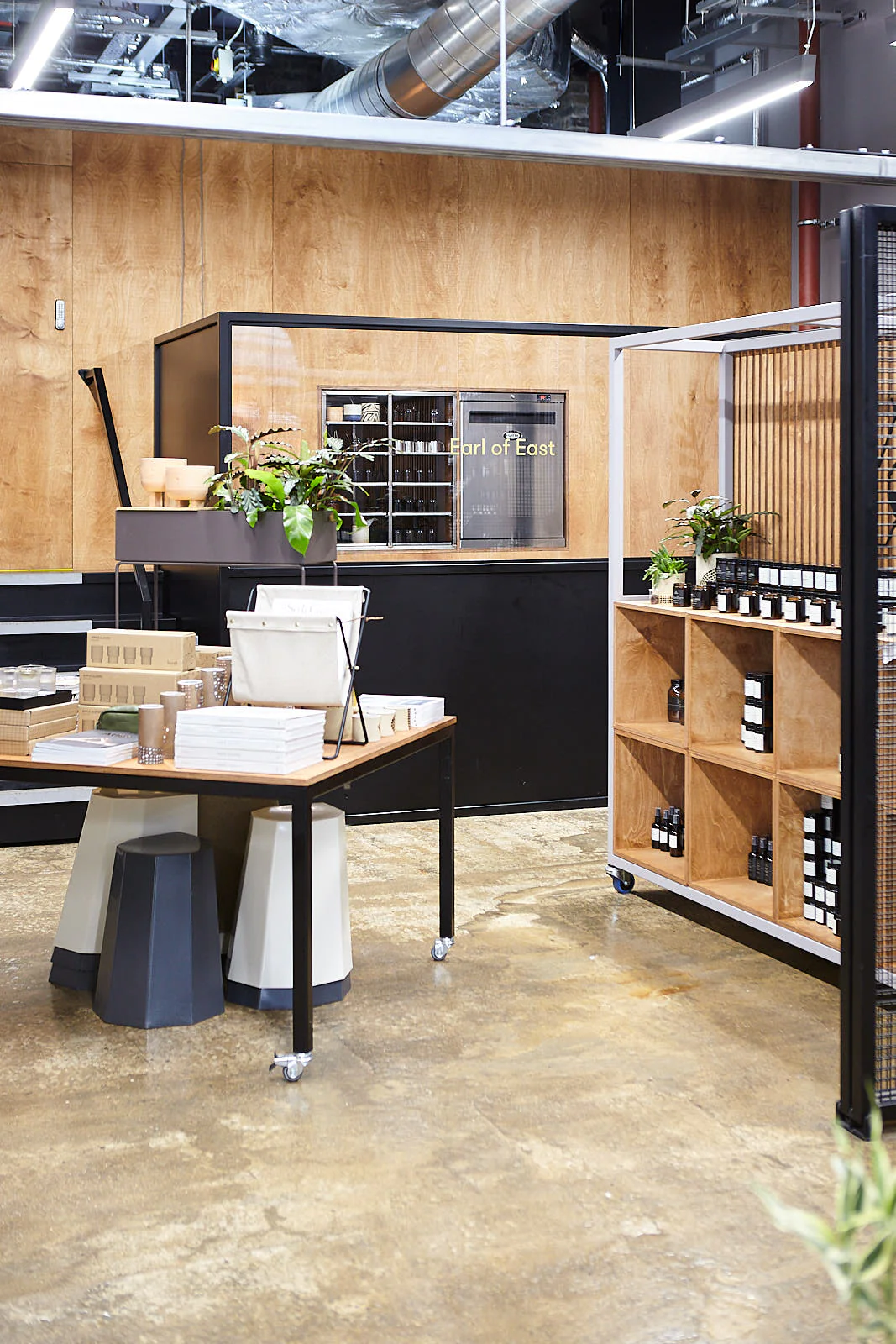 Earl of East's storefront includes rolling wooden display tables and shelving.