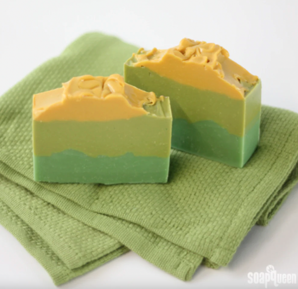 Green and yellow-striped soap bars on green cloth