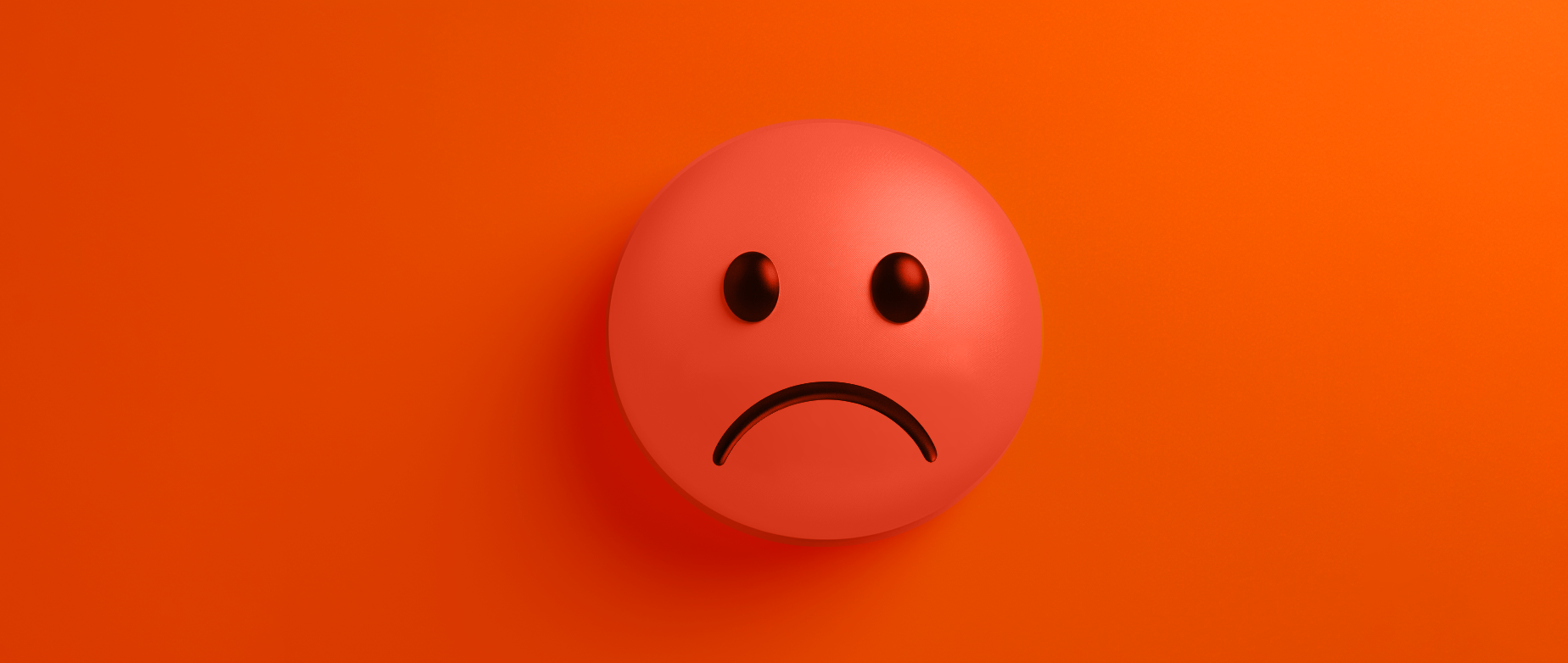 Red sad face over a red background.