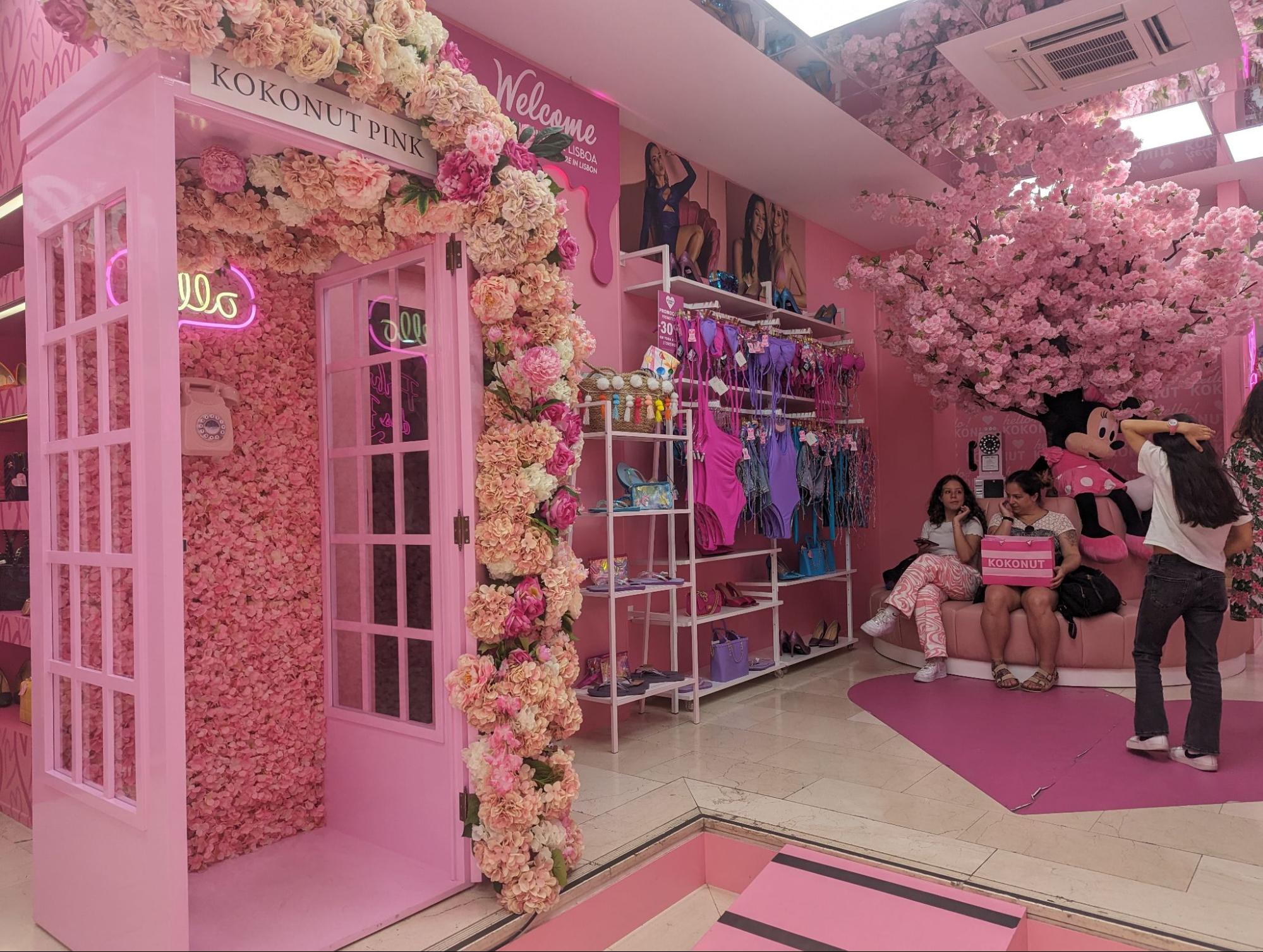 Photo of Kokonut Pink store entrance with pink phone booth and walls