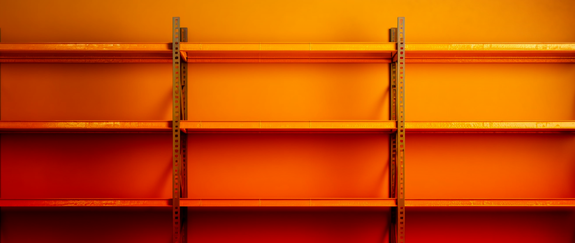 An orange empty storage room with shelves and a light on.