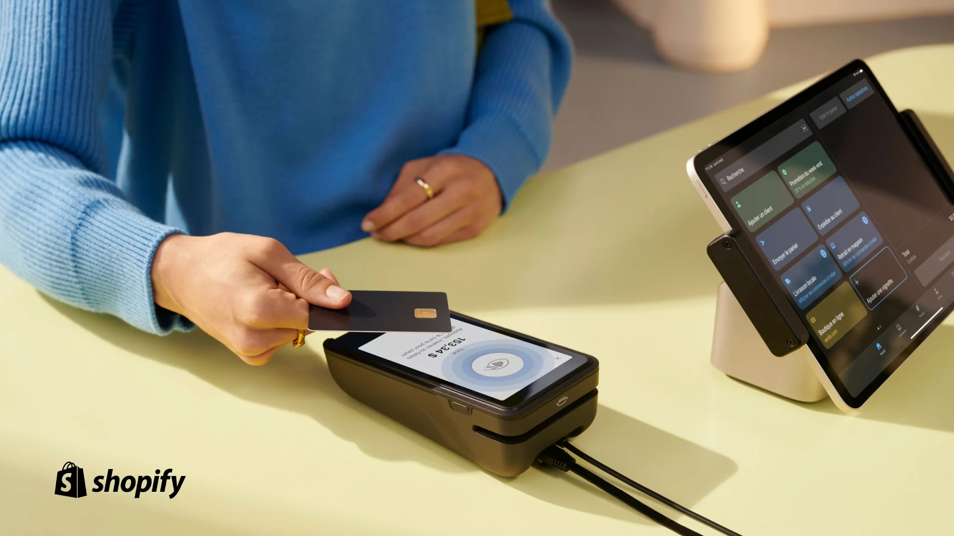 A customer taps their chip-enabled card on Shopify POS terminal