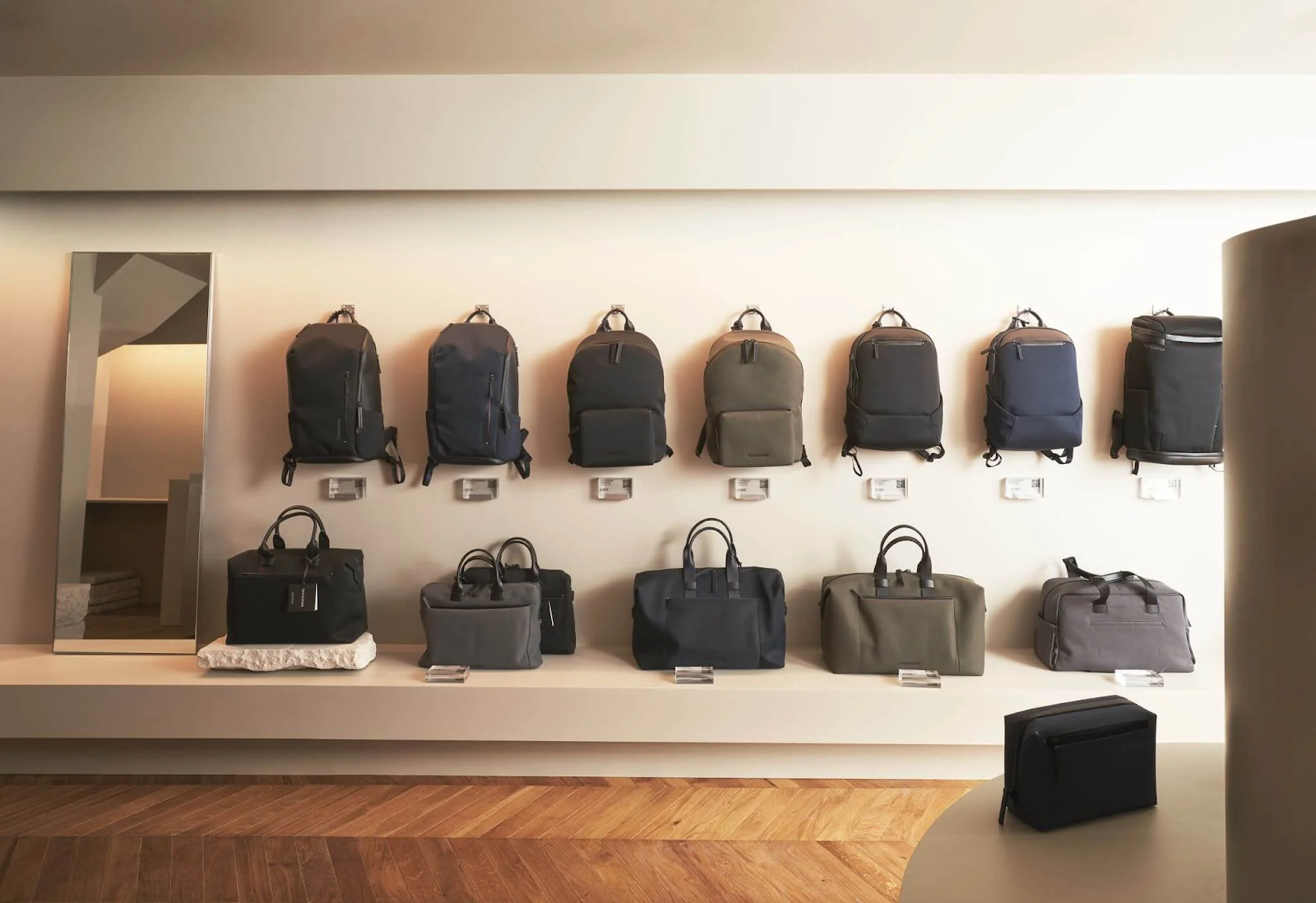 Bag brand Troubadour keeps the focus on its products by hanging backpacks directly on the wall.