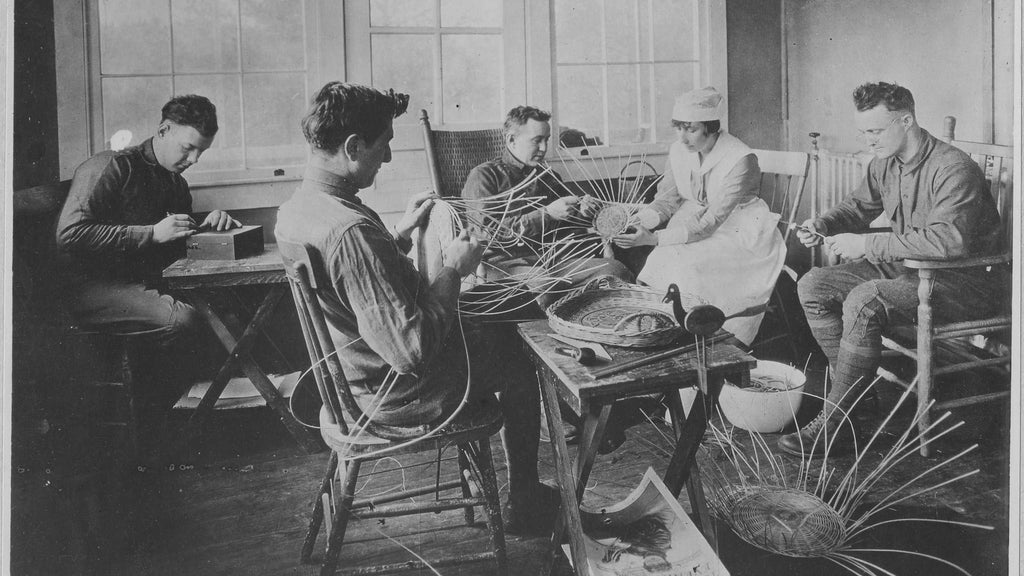 Men in hospital weaving baskets together