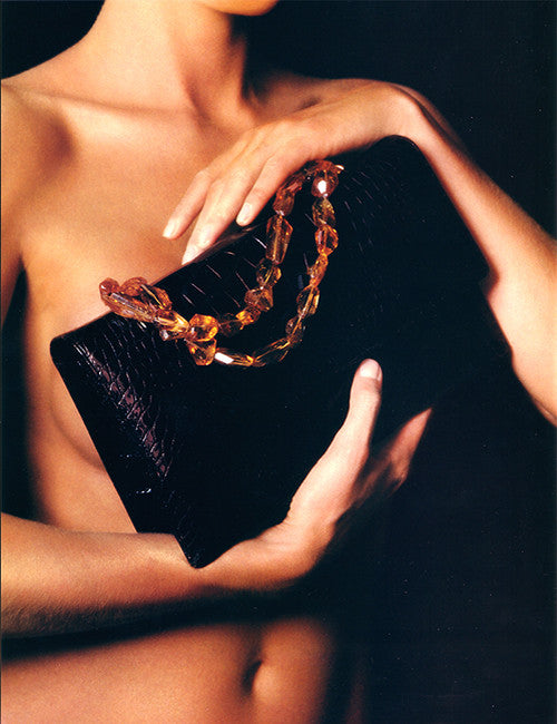 Model holding Darby Scott Iconic Necklace Handbag in Alligator