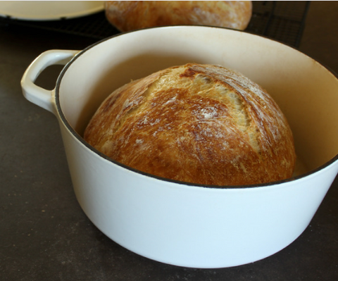 Enameled Dutch oven with baked sourdough bread