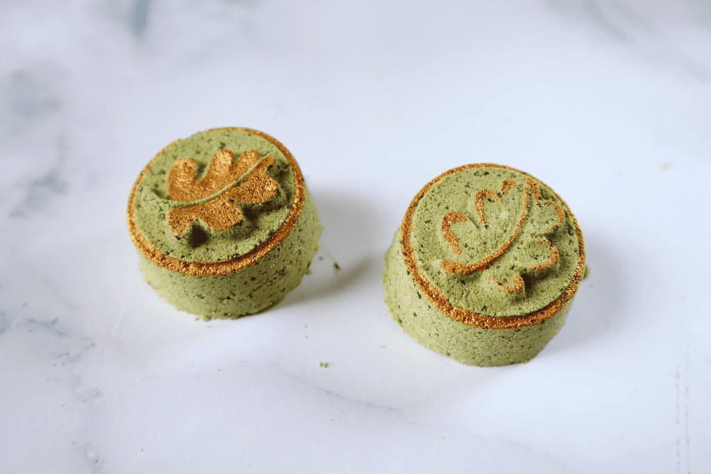 gold details painted on bath bombs with mica powder