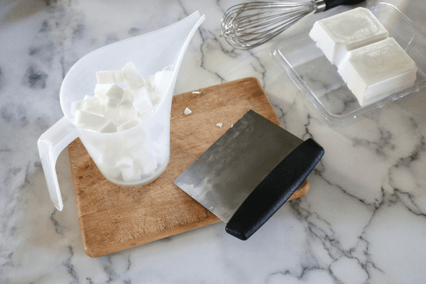 cubes of soap base in a pitcher