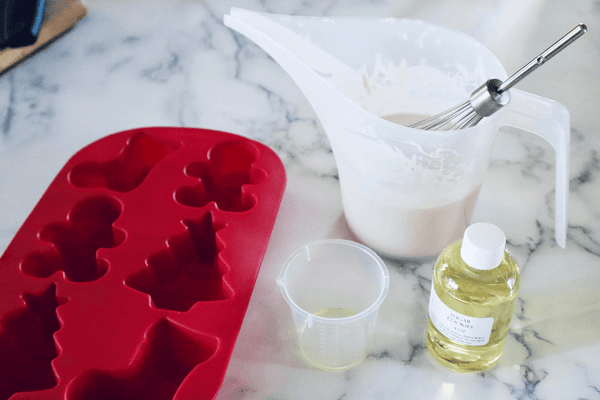 fragrance oil being added to melted soap base