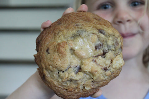 One of my kids with a huge kitchen sink cookie