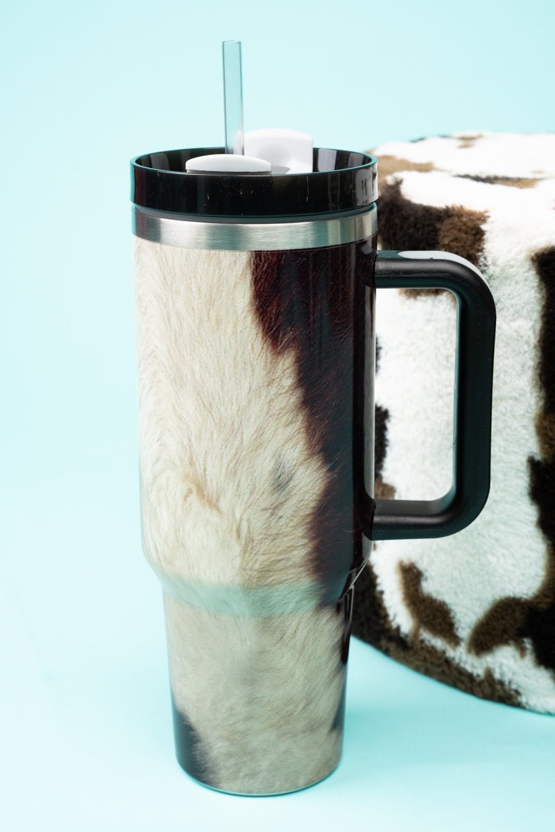 https://cdn.shopify.com/s/files/1/1250/2653/products/hndltmblr-38-brownfurcowthe-traveler-callie-cow-stainless-steel-tumbler-970328_1600x.jpg?v=1684871301