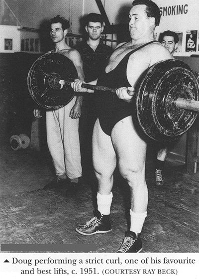 1951 - Strongman Doug Hepburn performing the Strict Barbell Curl - Photo by Ray Beck