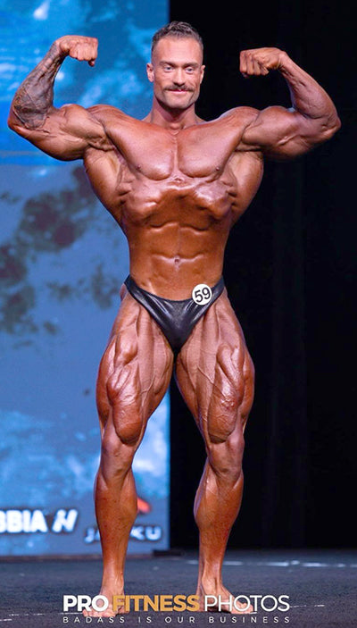 2022 Mr Olympia Classic Physique Winner Chris Bumstead - Photograph by Pro Fitness Photos