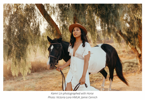 Kamri Lin photographed with a Horse
