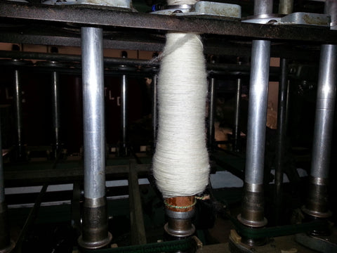machine spinning yarn onto a spindle