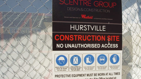 Safety sign on the fence of an Australian construction site.