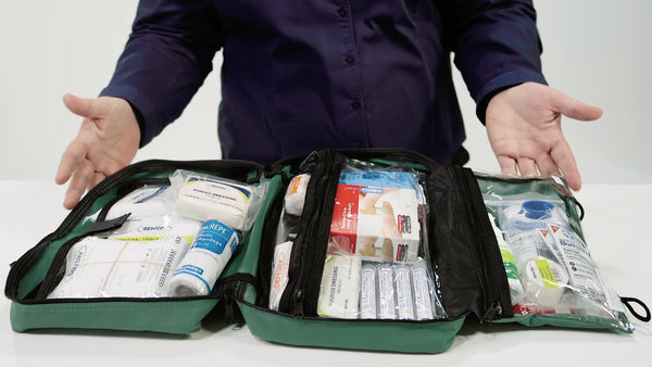Preparing to undertake a workplace first aid kit audit on an open workplace first aid kit