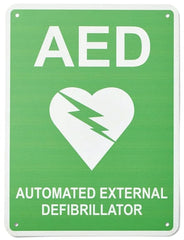 Photo of workplace first aid sign of a white heart with a lightning bolt symbol indicates the presence of a defibrillator or AED - Automated External Defibrillator.