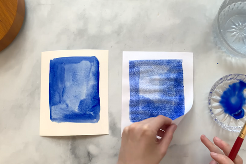 Watercolor paint on two different types of paper