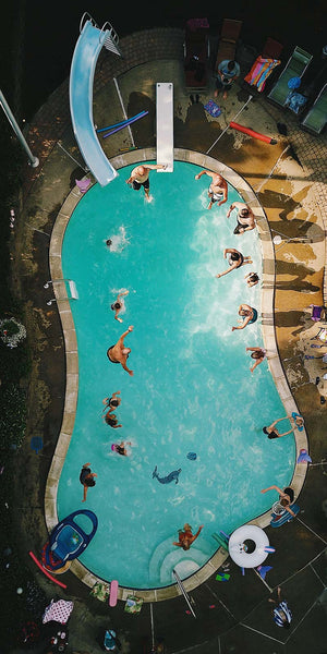 Vertical high angle view of a pool during a pool party reception under the sunlight in the us
