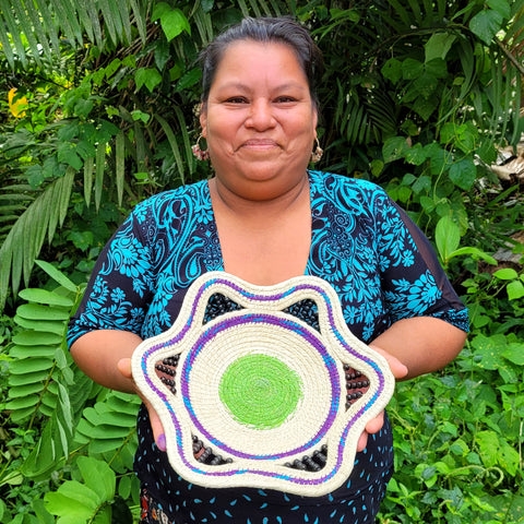 Chino artisan Rosa Sanchez with woven chambira palm fiber basket