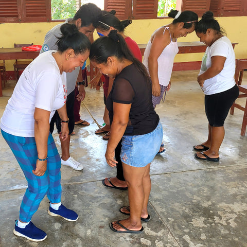 Artisans doing "head to head" activity at Puca Urquillo