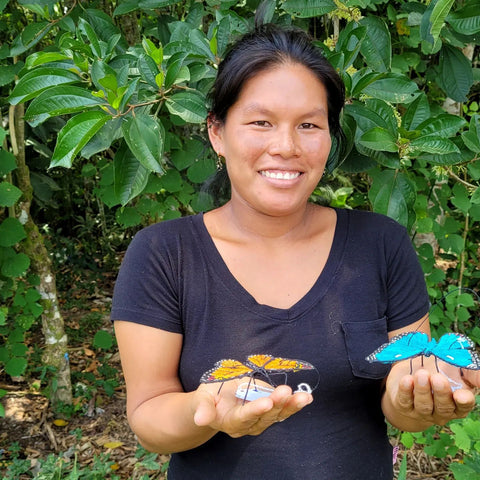 Bora artisan from Puca Urquillo with chambira butterfly ornaments