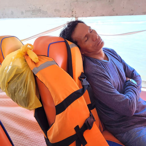 Pablo Pizango sleeping on rapido heading back to Iquitos