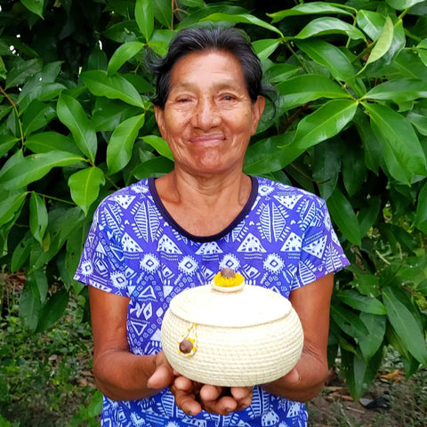 Adela Macuyama with woven chambira pot and lid