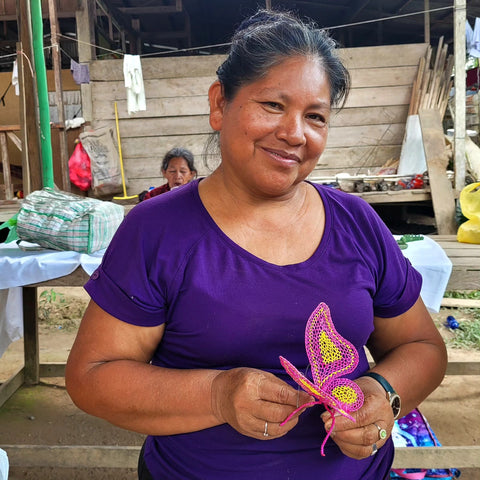 Artisan from Puerto Miguel with chambira butterfly