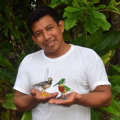 Artisan Edson from San Francisco with woven birds. Photo by Campbell Plowden/Amazon Ecology