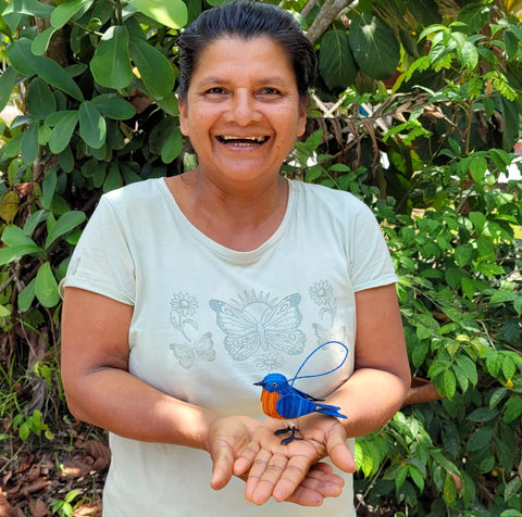 Amazonas artisan Francisca Orosco with bluebird ornament