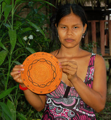 Bora artisan from Brillo Nuevo with woven trivet. Photo by Campbell Plowden/Amazon Ecology