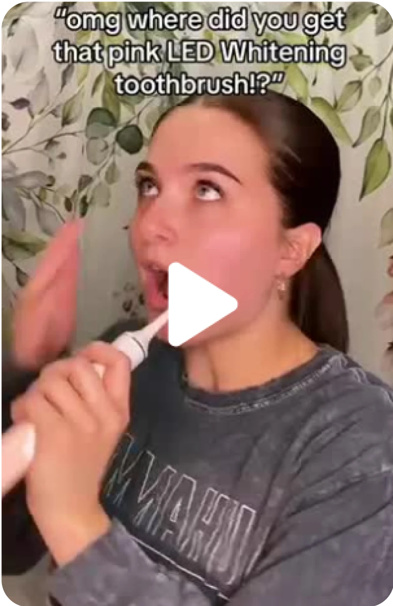 Person brushing teeth with electric toothbrush, text above reads: 'omg where did you get that pink LED Whitening toothbrush!?'